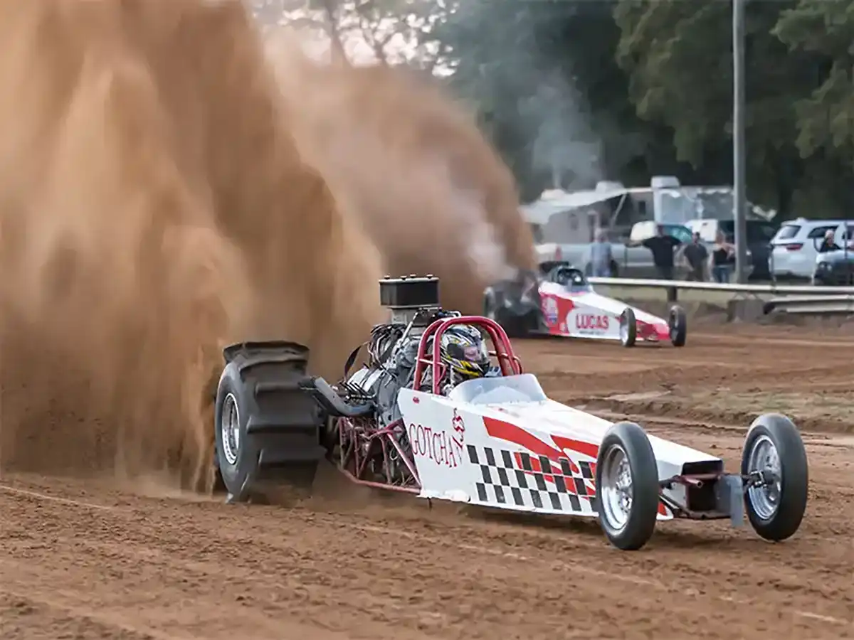 A sand dragster kicking up dirt at Atoka Motorsports Park, Atoka, OK